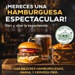 Delicious gourmet hamburger with crispy fries and cold beer at Consulado Food Crew, a top family restaurant bar lounge in Rosarito Baja California offering casual dining, burgers, drinks, and a relaxed nightlife atmosphere.